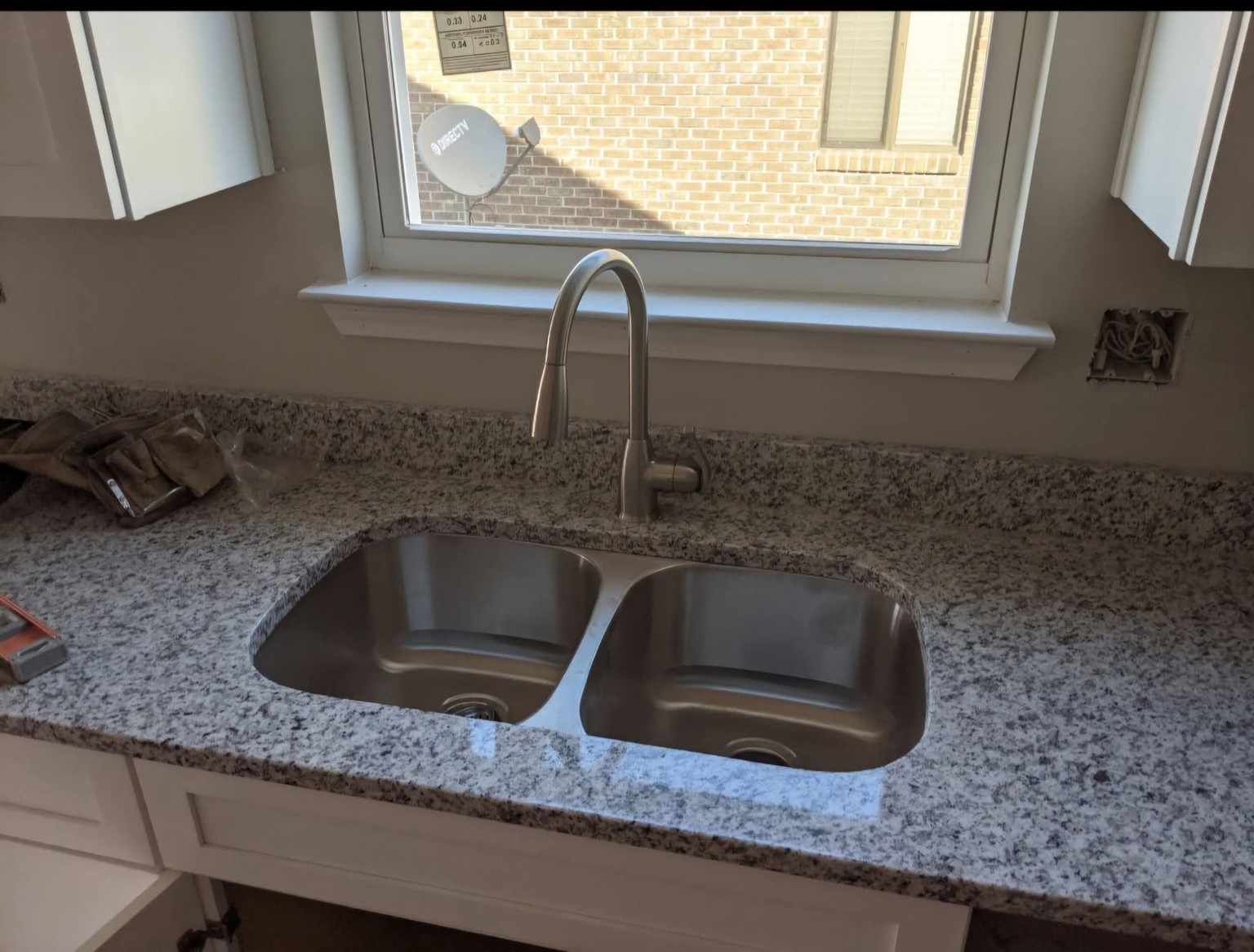 Double bowl stainless steel kitchen sink with tall faucet