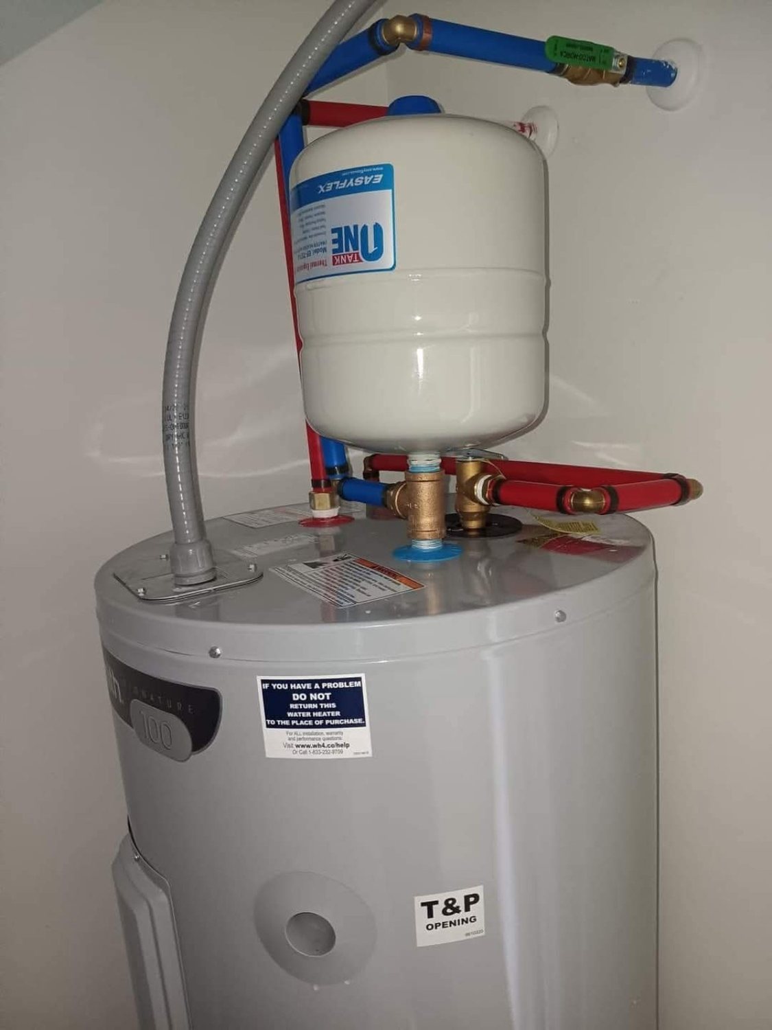 Water heater installation with expansion tank and PEX piping